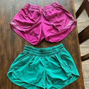 Two pairs of Lululemon hotty hot shorts Shorts in Magenta and Teal size 6